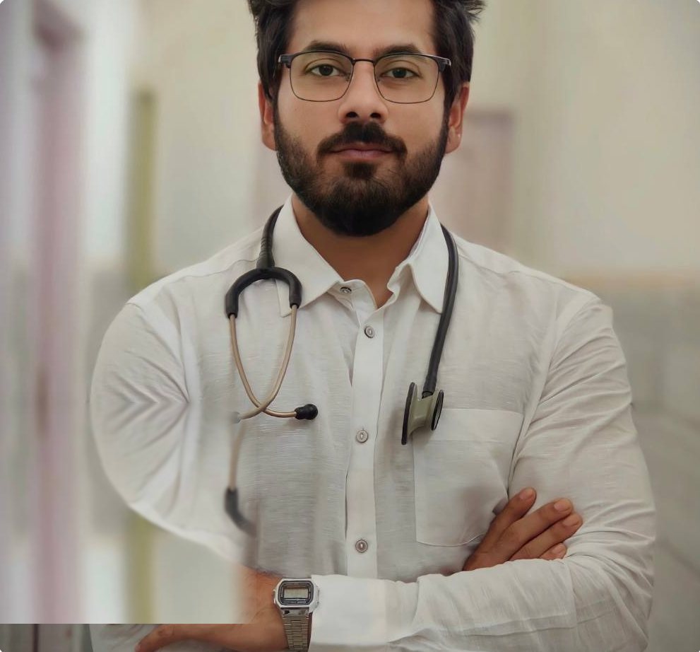 An Indian physician with a stethoscope, arms crossed